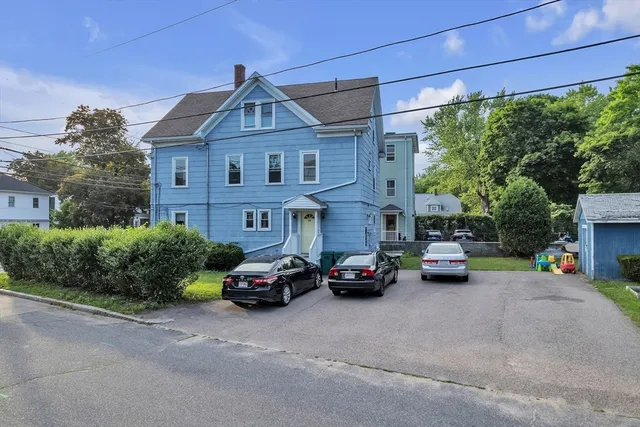 a car parked in front of a house