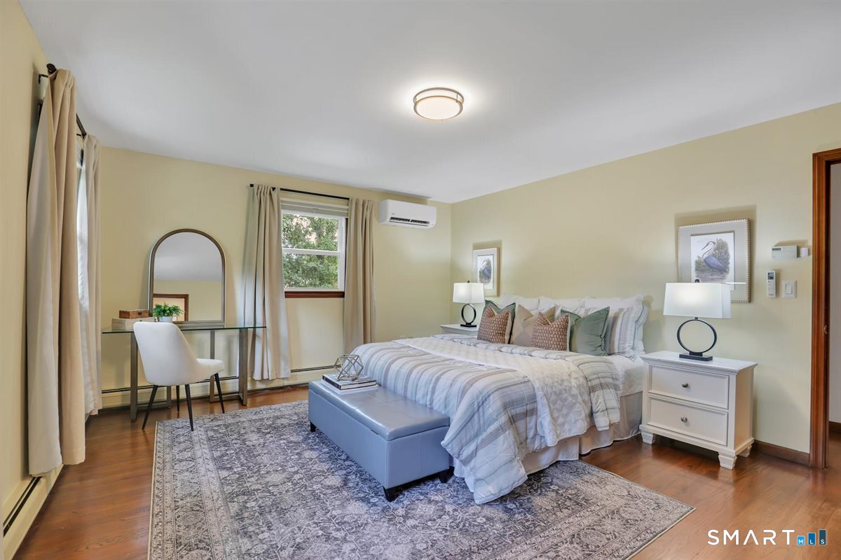 186 Alps Road Branford, CT 06405 - Photo 14 of 35 All four bedrooms are located on the upper level and feature hardwood flooring and individual mini-split systems for year-round comfort.