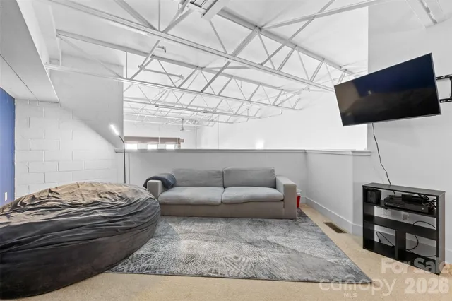 a living room with a couch and a flat screen tv