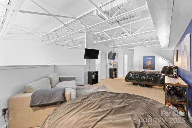 a bedroom with furniture and a fireplace