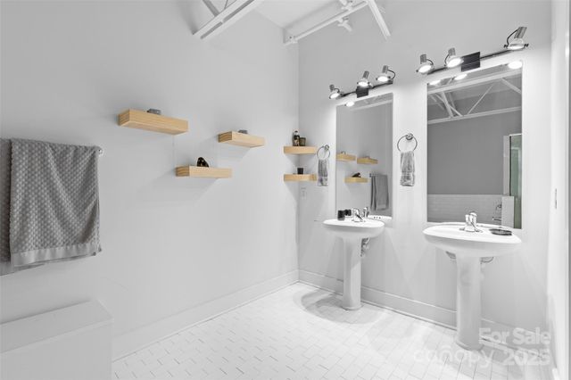 a bathroom with a sink and mirror