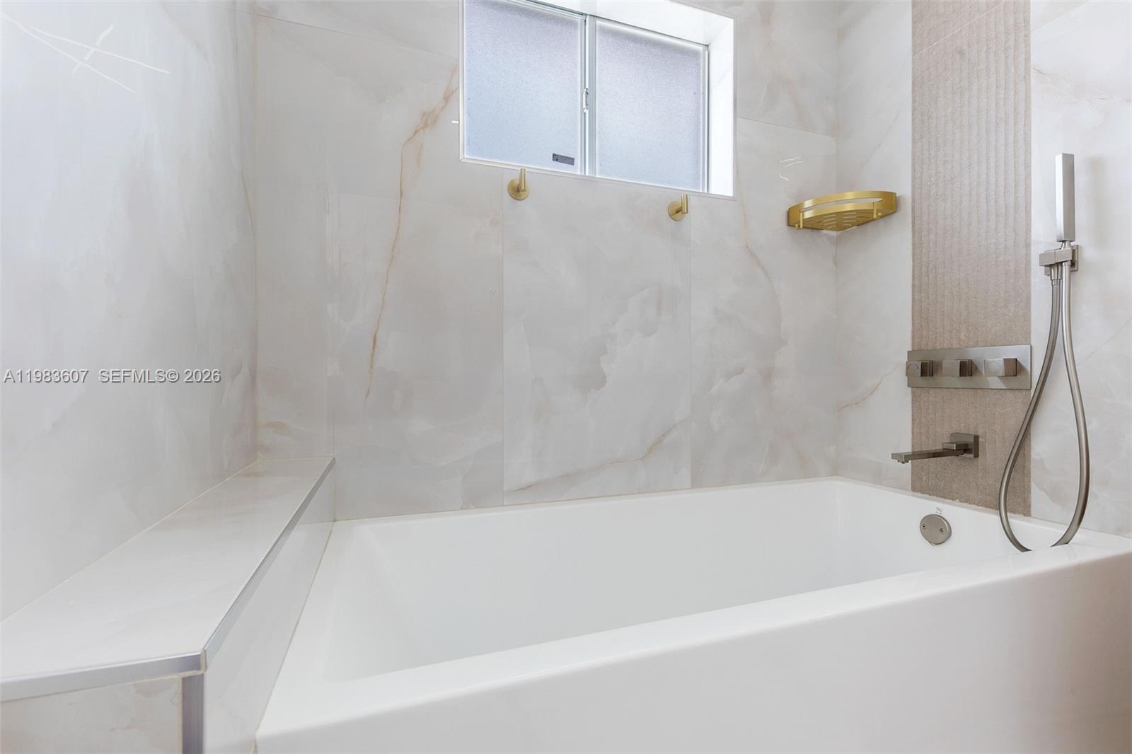 2897 Southwest 129th Way Miramar, FL 33027 - Photo 13 of 22 a bathroom with a bathtub