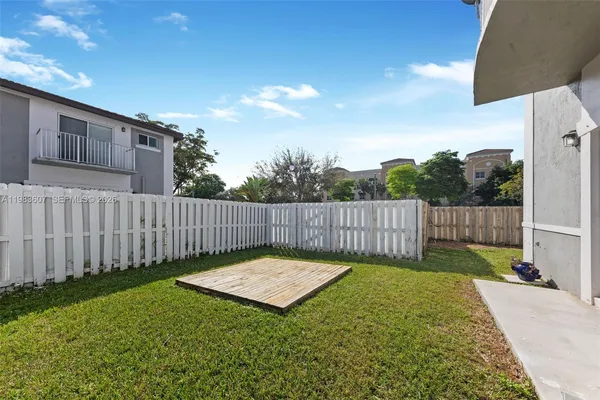 a view of a backyard with a small cabin