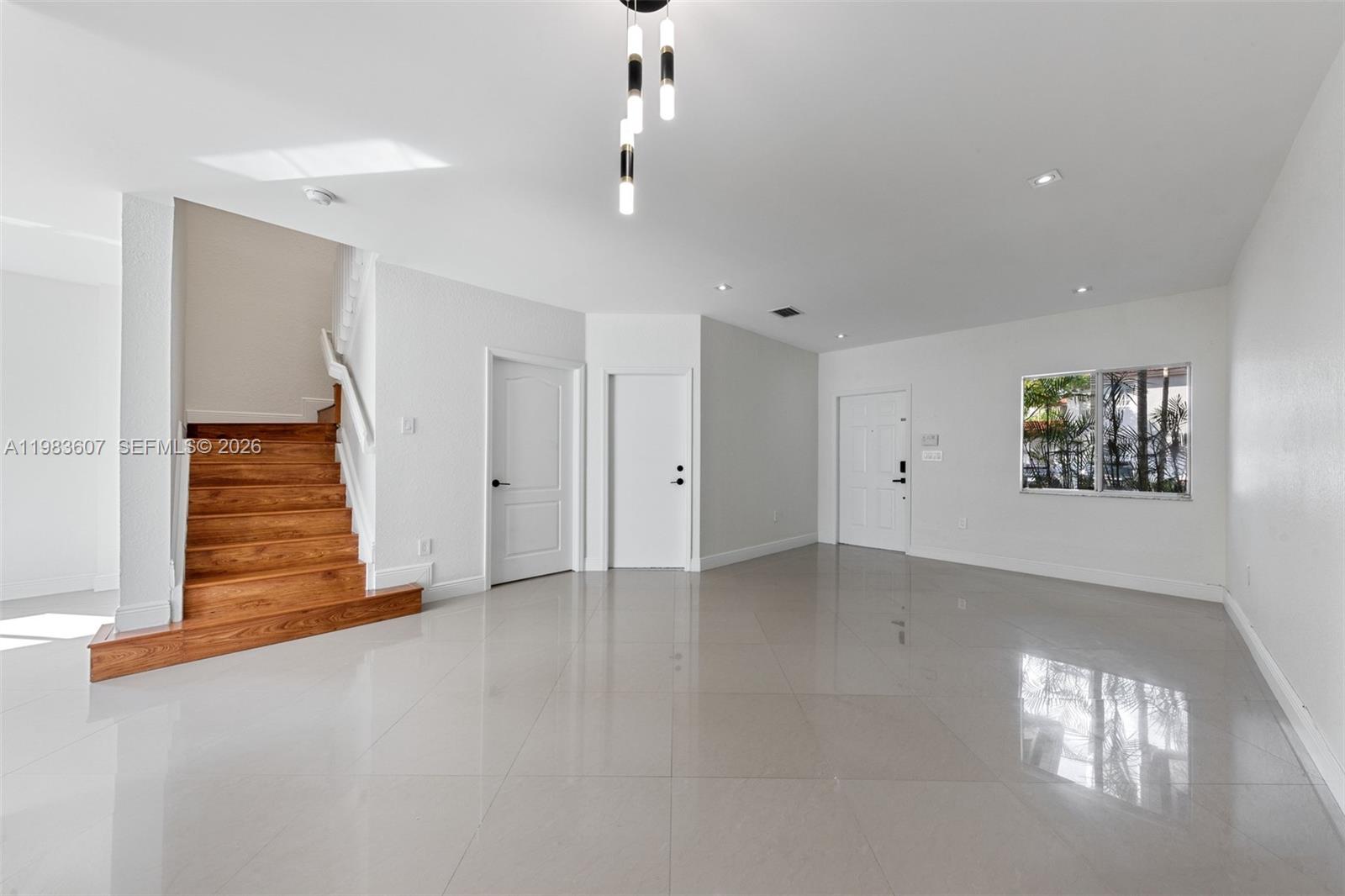 2897 Southwest 129th Way Miramar, FL 33027 - Photo 10 of 22 an empty room with windows and pillars in it