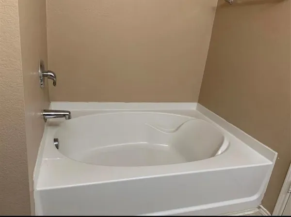 a white bath tub sitting in a bathroom
