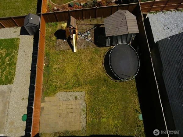 an aerial view of a house with a swimming pool