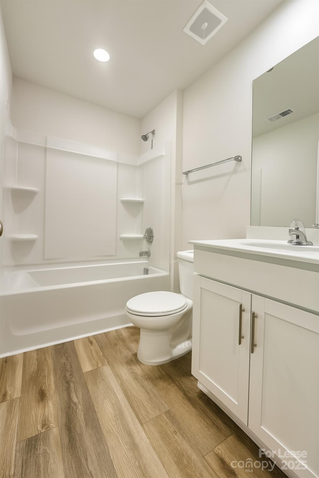 6104 Faron Way Charlotte, NC 28262 - Photo 15 of 17 a bathroom with a sink a toilet and shower