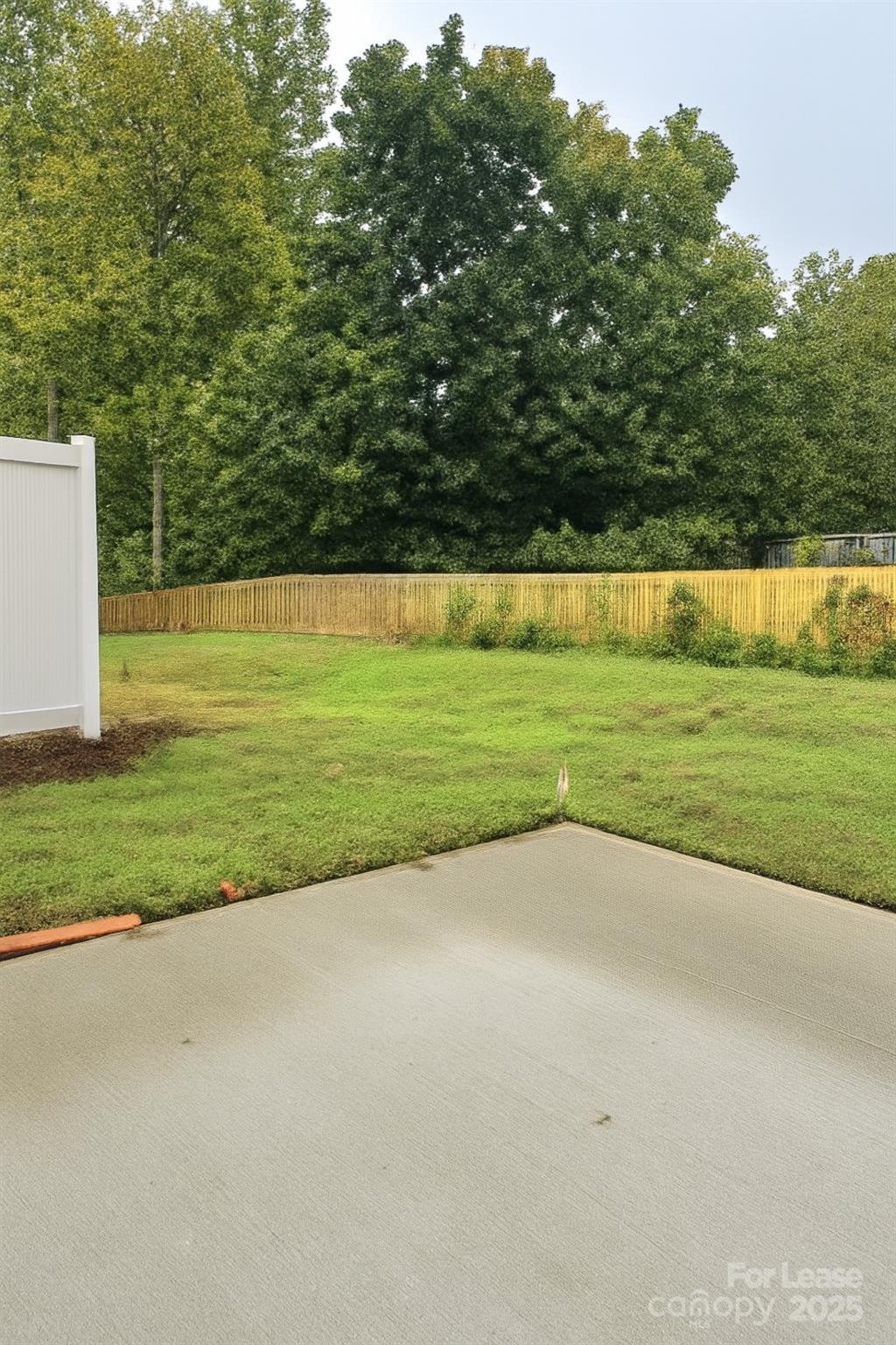 6104 Faron Way Charlotte, NC 28262 - Photo 16 of 17 a view of a swimming pool with a yard