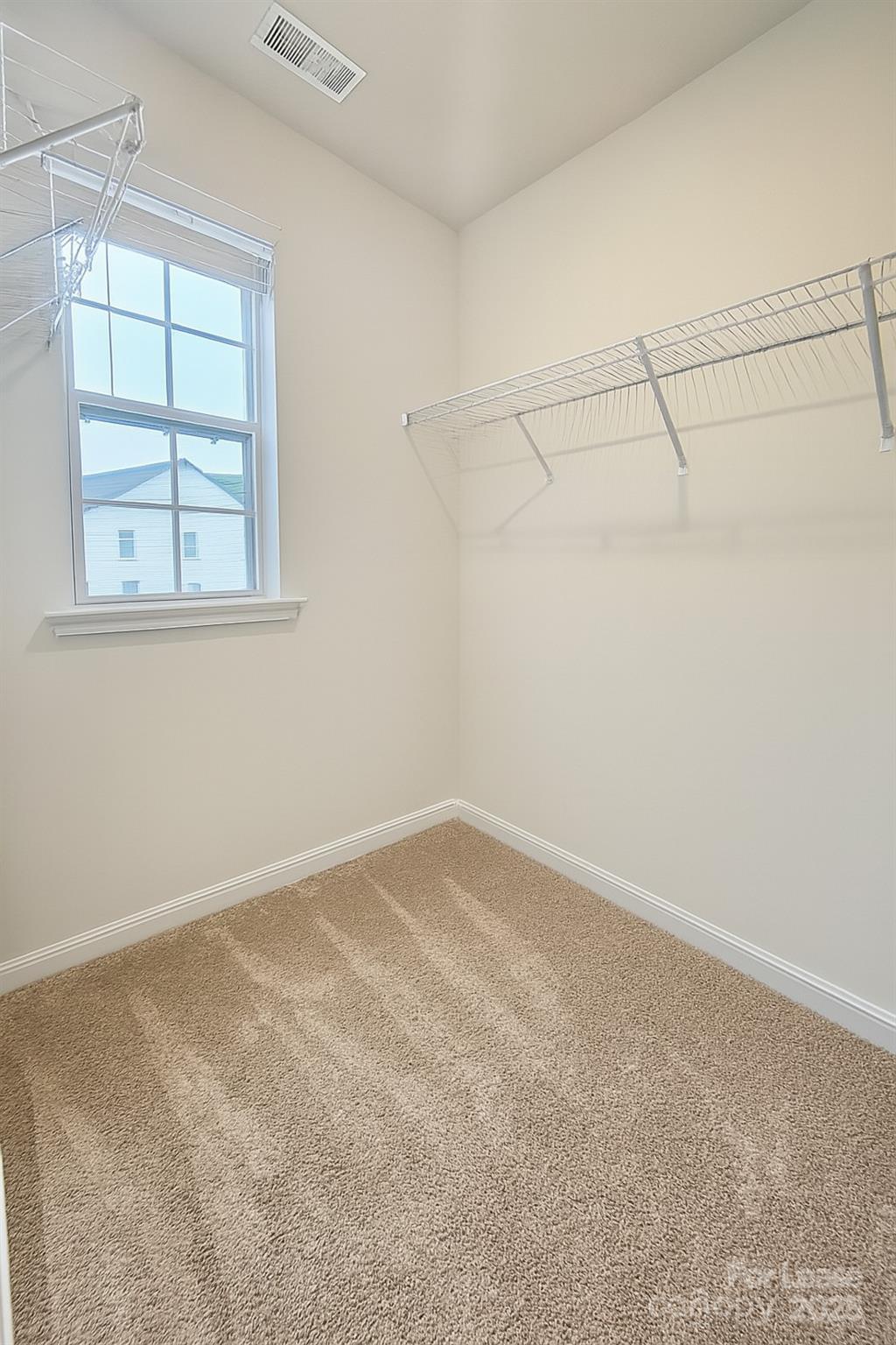6104 Faron Way Charlotte, NC 28262 - Photo 8 of 17 an empty room with a empty space and windows