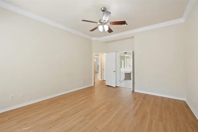 a view of an empty room and wooden floor