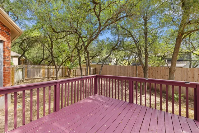 a view of wooden deck and a trees