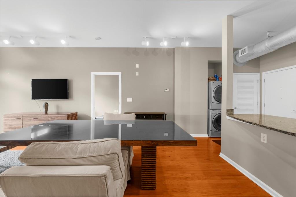 5300 Peachtree Road, Unit 1608 Chamblee, GA 30341 - Photo 15 of 47 a living room with furniture and a flat screen tv