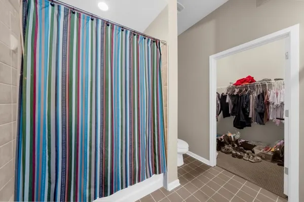 a bathroom with a white bathtub