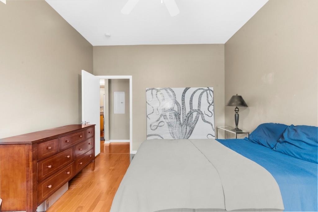 5300 Peachtree Road, Unit 1608 Chamblee, GA 30341 - Photo 26 of 47 a bedroom with a bed and dresser with mirror