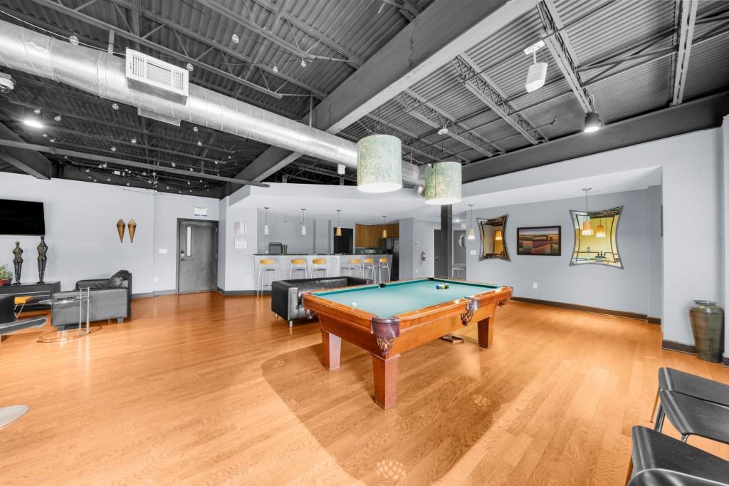 5300 Peachtree Road, Unit 1608 Chamblee, GA 30341 - Photo 33 of 47 a living room with furniture pool table and a fireplace