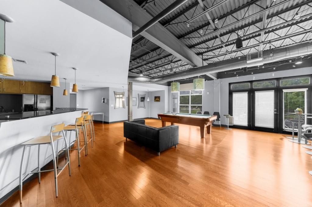 5300 Peachtree Road, Unit 1608 Chamblee, GA 30341 - Photo 34 of 47 a living room with furniture and a large window