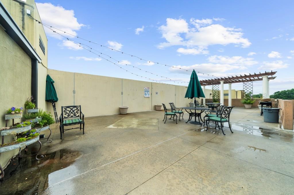 5300 Peachtree Road, Unit 1608 Chamblee, GA 30341 - Photo 37 of 47 a view of a patio with table and chairs
