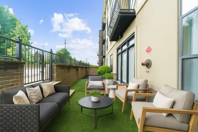 a building outdoor space with patio furniture