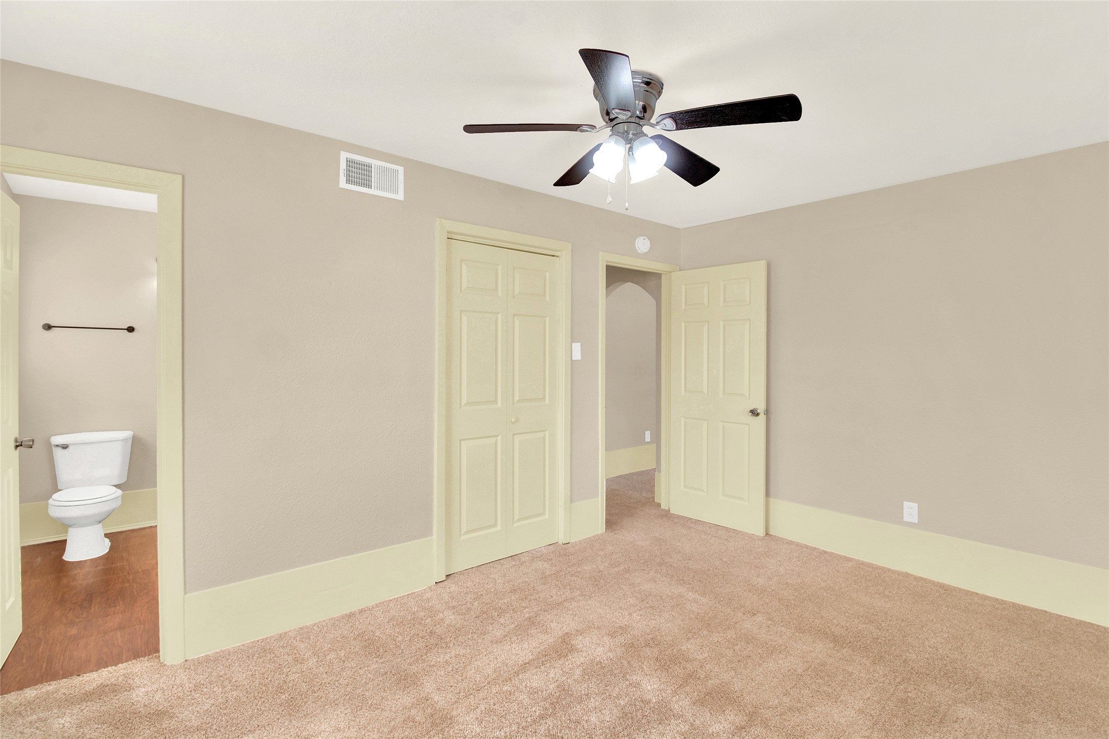 506 Edgebrook Drive Houston, TX 77034 - Photo 9 of 18 Primary bedroom has an en-suite bathroom and ceiling fan.