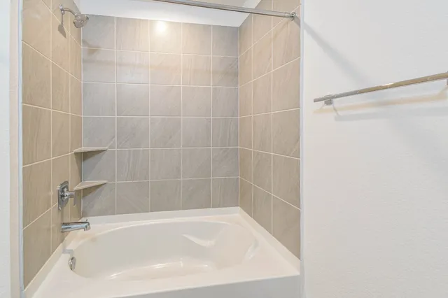 a close up of a bathtub curtain