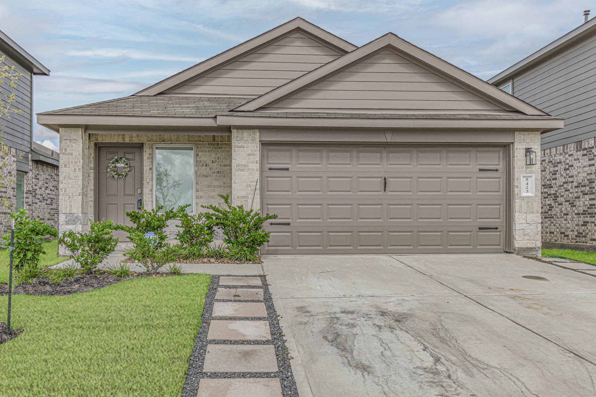 5423 Wyndham Ridge Ln Spring Spring, TX 77373 - Photo 2 of 23 a front view of a house with a yard and garage