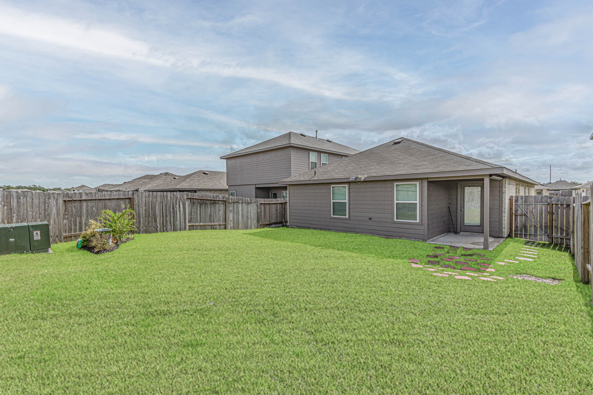 5423 Wyndham Ridge Ln Spring Spring, TX 77373 - Photo 4 of 23 a view of a house with backyard and garden