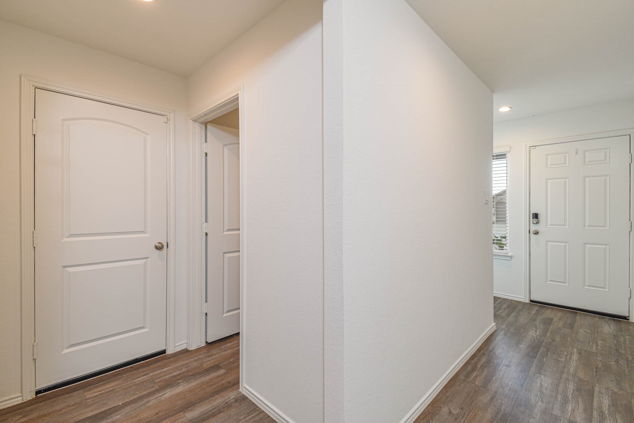 5423 Wyndham Ridge Ln Spring Spring, TX 77373 - Photo 8 of 23 a view of a hallway with wooden floor