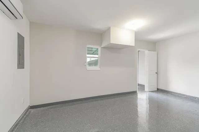 an empty room with a empty space and window