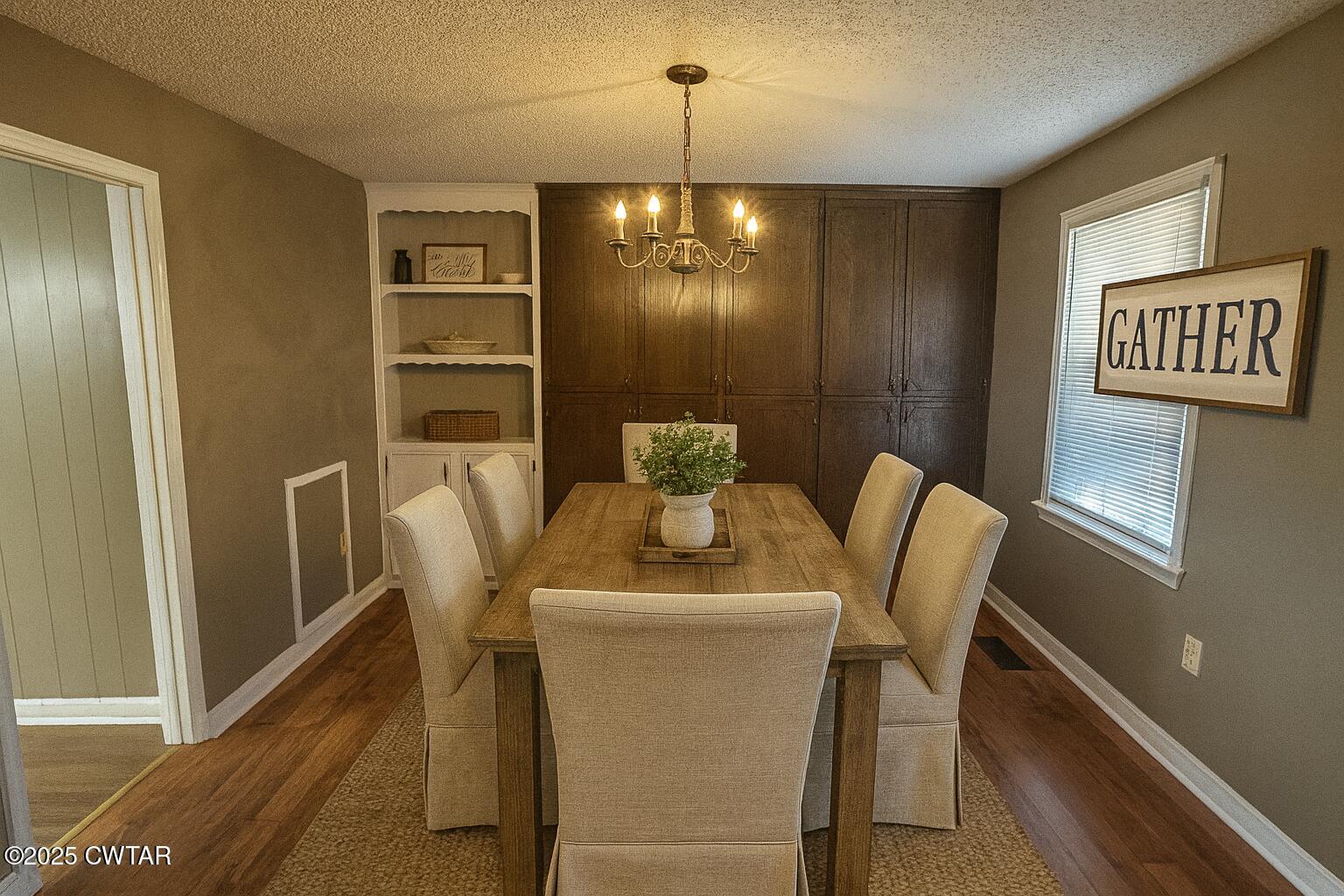 1705 Highway 100 Decaturville, TN 38329 - Photo 13 of 45 a dining room with furniture and window