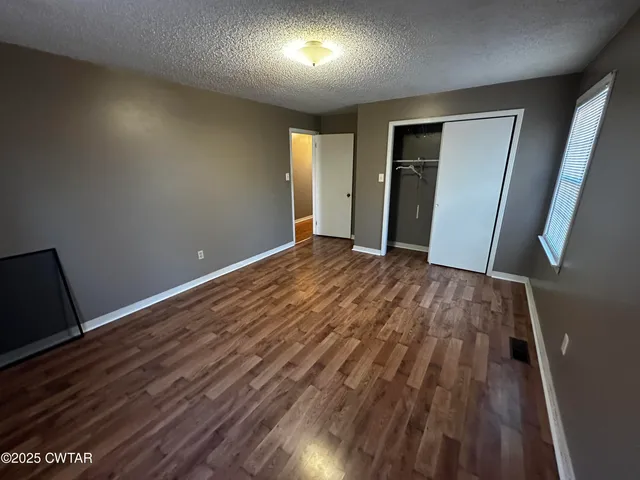 a backyard of a house with outdoor seating