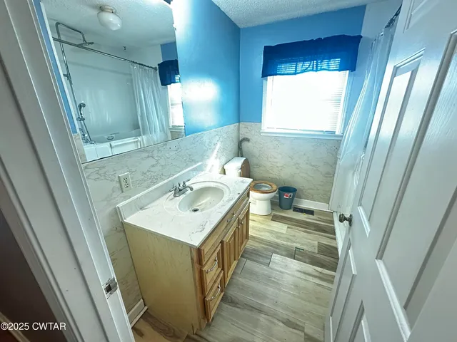 a reading room with furniture and a pool table