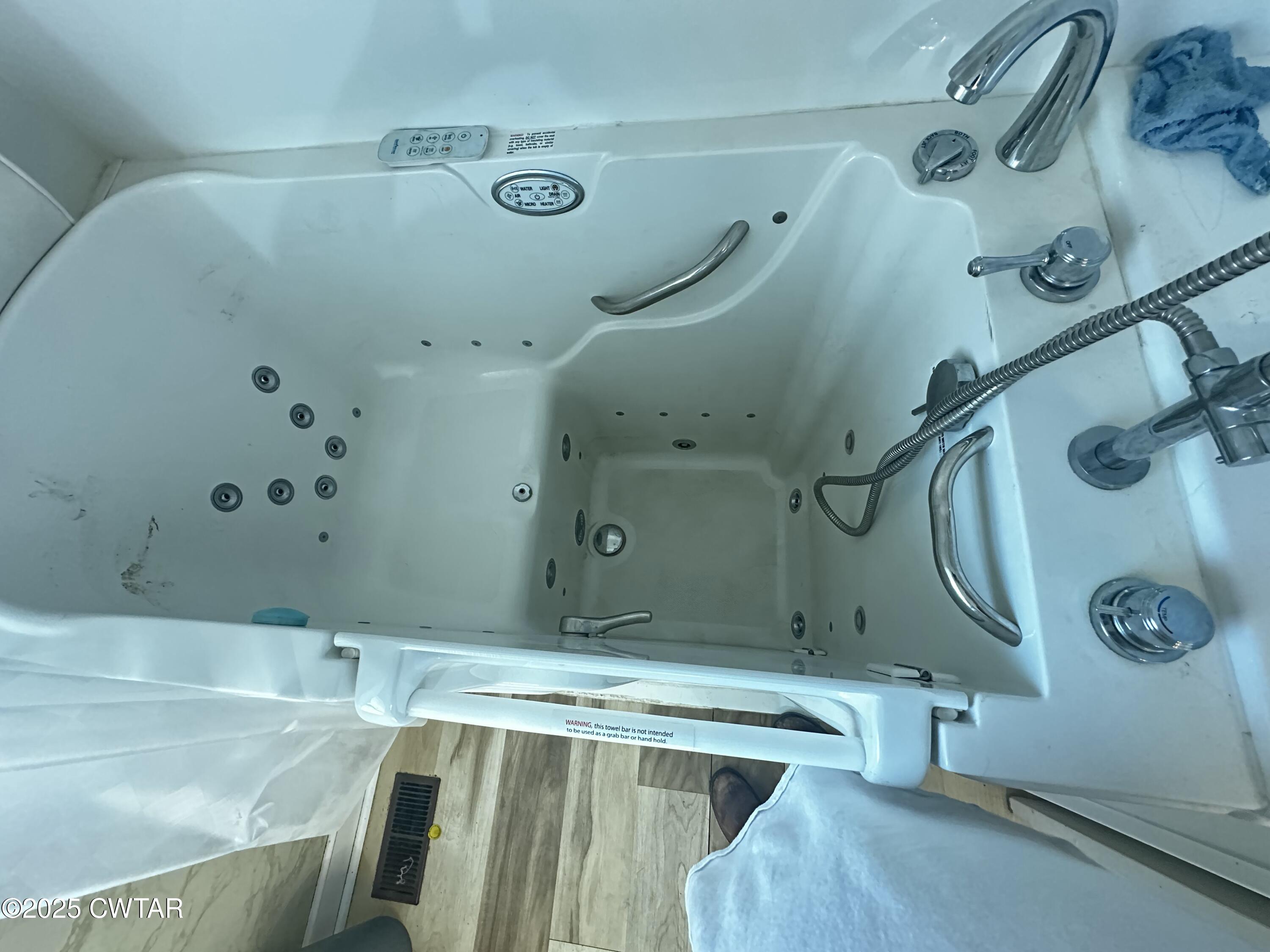 1705 Highway 100 Decaturville, TN 38329 - Photo 34 of 45 a bathroom with a tub sink and mirror