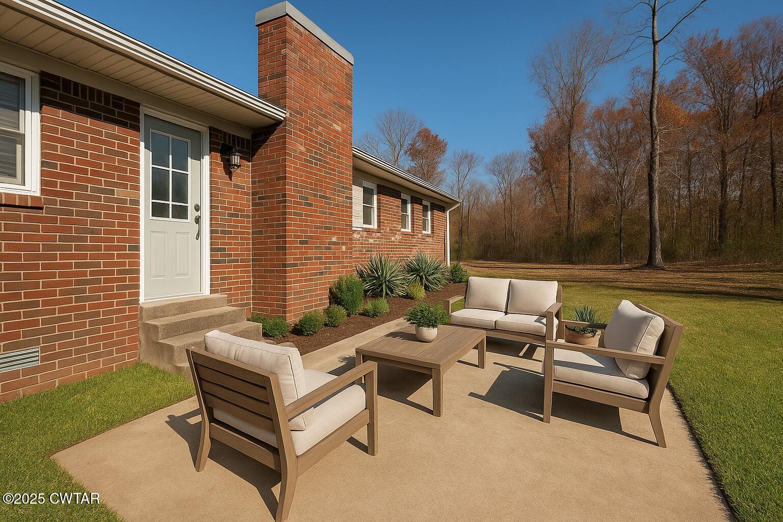 1705 Highway 100 Decaturville, TN 38329 - Photo 37 of 45 a backyard of a house with outdoor seating