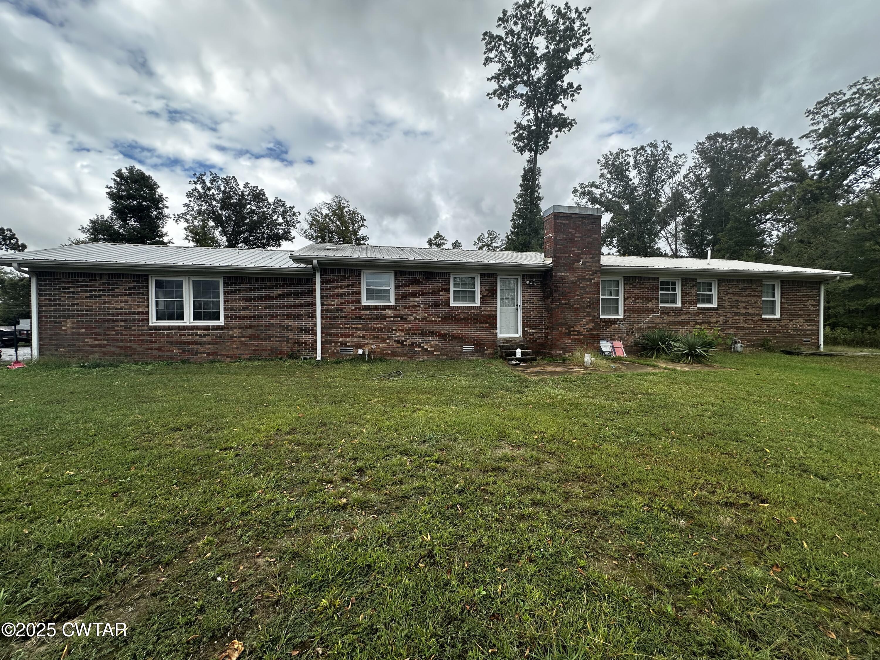 1705 Highway 100 Decaturville, TN 38329 - Photo 38 of 45 a front view of house with yard and green space