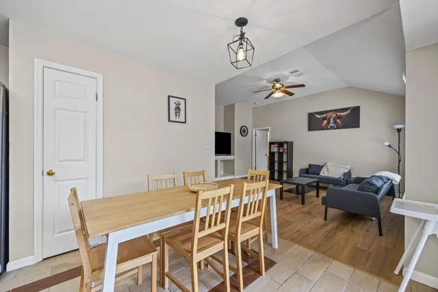 a bedroom with a bed and a table