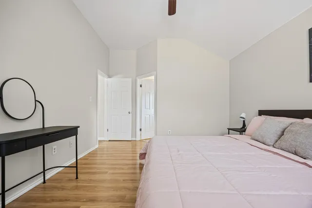 a bathroom with a tub a sink and mirror