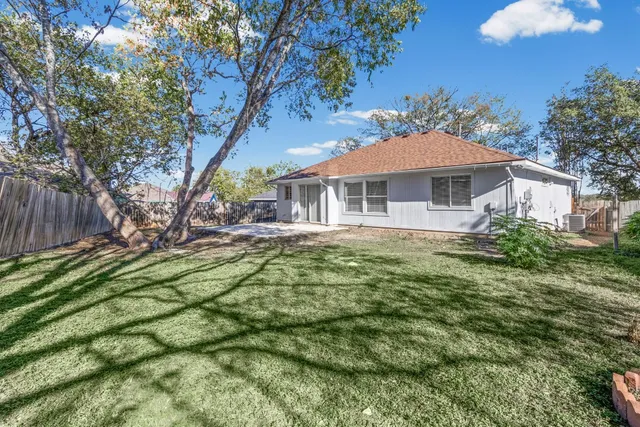 an aerial view of residential house with outdoor space