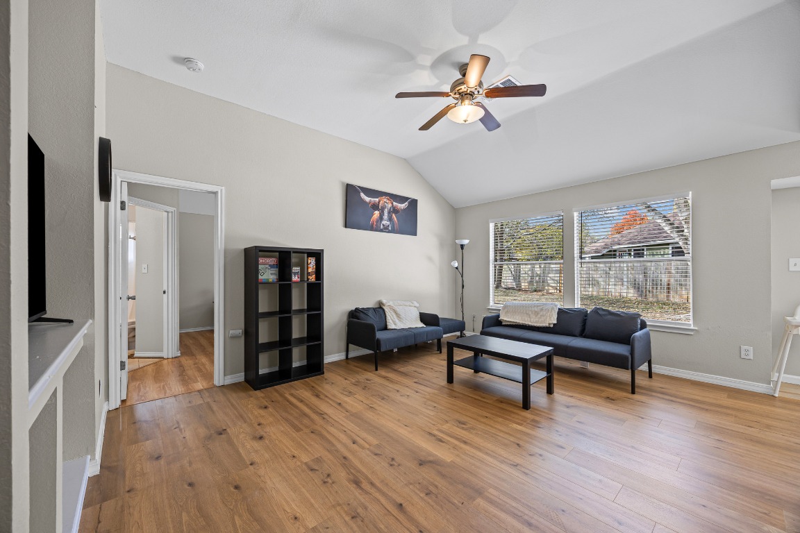5006 Acorn Grove Court Austin, TX 78744 - Photo 4 of 36 a living room with furniture and a wooden floor