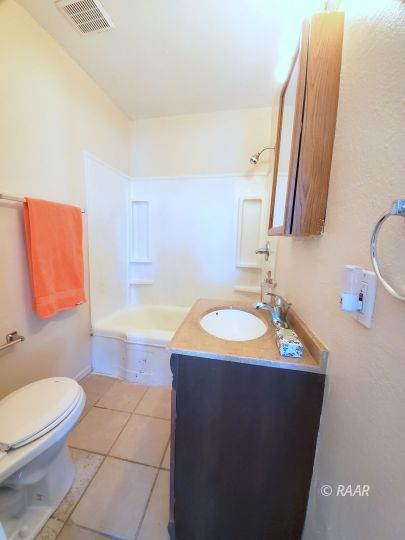 237 Sunset Place Ridgecrest, CA 93555 - Photo 8 of 17 a bathroom with a sink and a mirror
