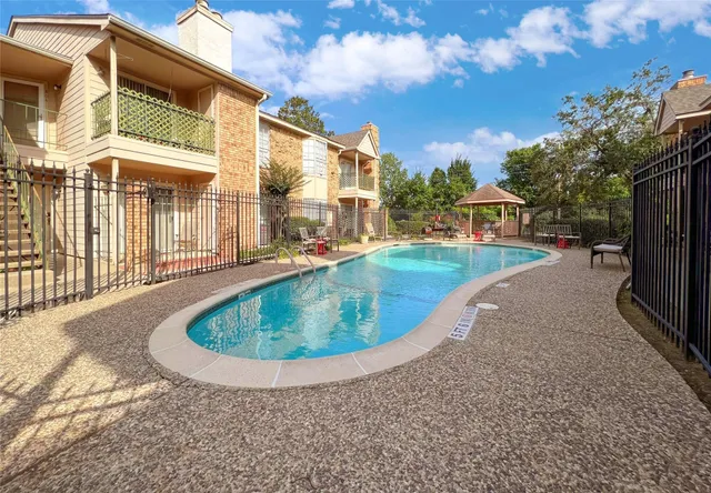 a view of a house with a swimming pool