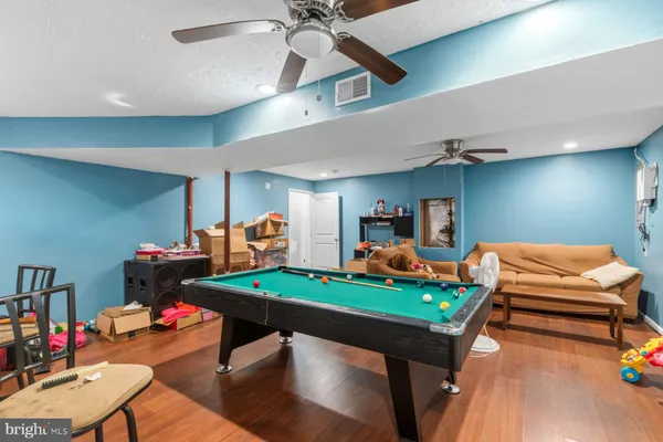 a room with furniture and gym equipment