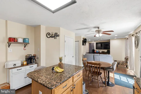 a kitchen with a table and chairs in it