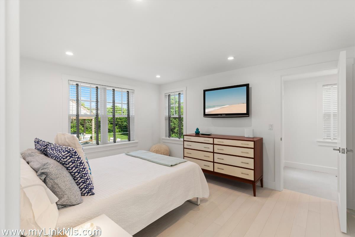 3 Tautemo Way Nantucket, MA 02554 - Photo 37 of 57 a bedroom with a bed and a large window