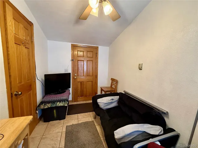 a living room with a flat screen tv and a fireplace