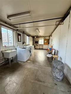 a living room with furniture window and a table