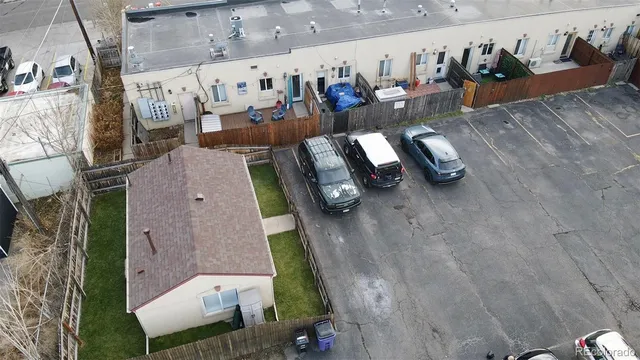 an aerial view of houses with outdoor space