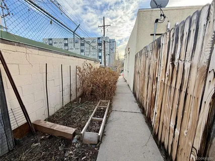 a view of a wooden door with a bench