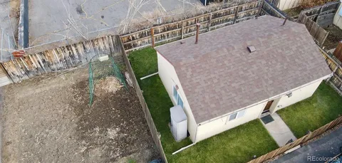 a aerial view of a house with a yard