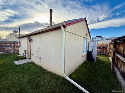 a view of a backyard with sitting area