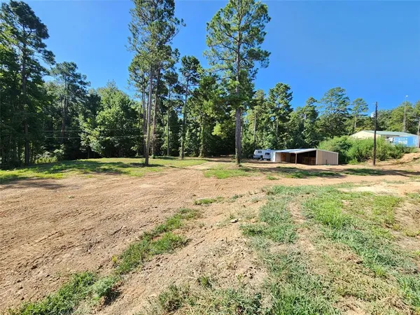 a swimming pool with an outdoor space and seating